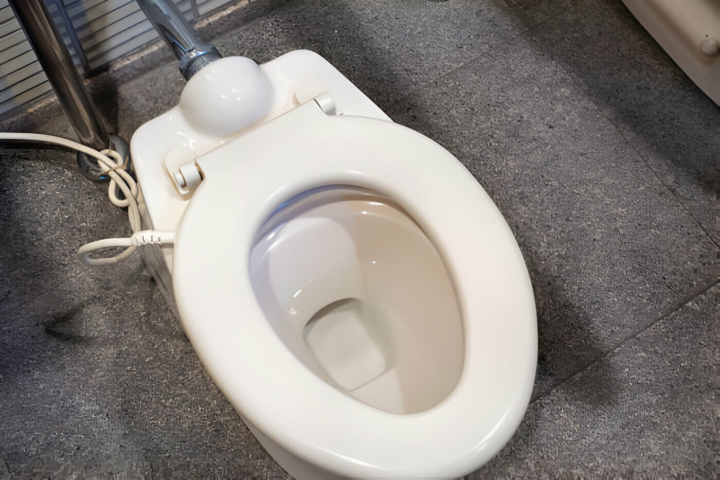 electric cord to the toilet seat for heating